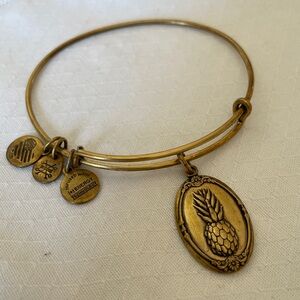 Alex and Ani Pineapple Charm Bangle Bracelet in Antique Yellow Tone.